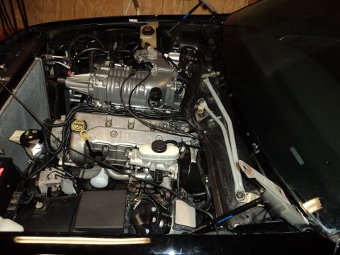 2004 Mercury Grand Marquis - Engine bay view showing a supercharger installed on a V8 engine.