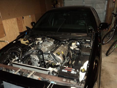 2004 Mercury Grand Marquis - Engine bay of a 2004 Mercury Grand Marquis showing a supercharger modification.