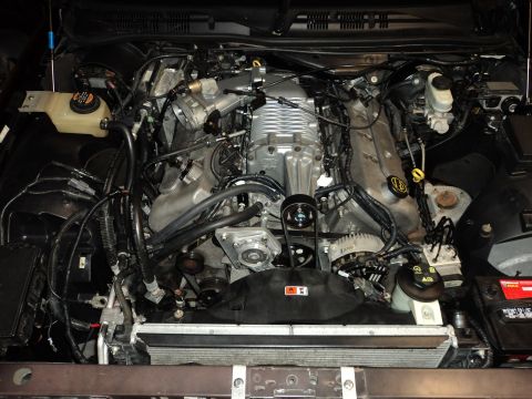 2004 Mercury Grand Marquis - Engine bay view shows a supercharger and associated components.
