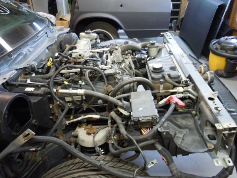 2001 Ford Crown Victoria - Engine bay of a 2001 Ford Crown Victoria, with the engine partially disassembled.