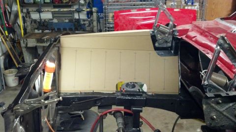 1964 Ford Fairlane - Wooden template being fitted into a car's engine bay, showing custom work in progress.