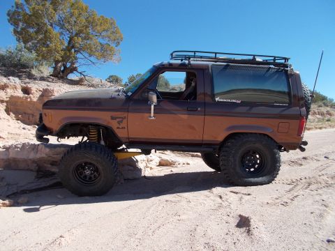 1986 Ford Bronco II - This 1986 Ford Bronco II is equipped for off-road adventures on a sandy, rocky terrain.