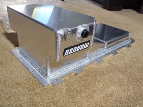 2003 Ford Crown Victoria - fabricated aluminum Moroso oil pan viewed from the side, showing a welded sump box, hex plug, and a black AN fitting.