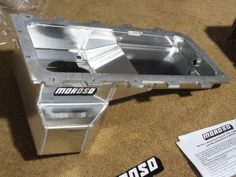 2003 Ford Crown Victoria - Fabricated aluminum Moroso oil pan with a deep kick-out sump shown from above beside a printed instruction sheet and decal.