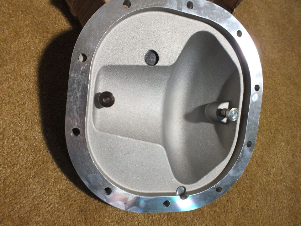Interior of cast aluminum differential cover with adjuster boss and bolt holes
