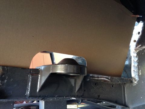 1964 Ford Fairlane - A close-up view of a vehicle's frame mount, possibly during a repair or modification process.