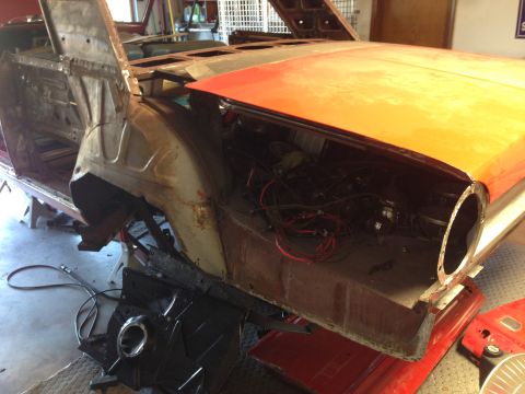 1964 Ford Fairlane - A 1964 Ford Fairlane is shown in a state of restoration, with its hood open and interior disassembled.