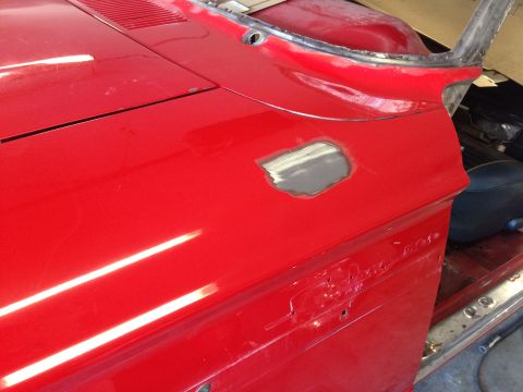 1964 Ford Fairlane - Bodywork in progress on a 1964 Ford Fairlane fender, showing a dent being repaired.