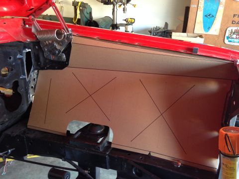 1964 Ford Fairlane - Cardboard template being fitted to a car's firewall during a custom build project.