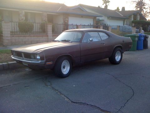 1968 Ford Mustang - This 1973 Dodge Dart Sport coupe is parked curbside in front of a residential home.