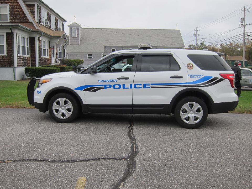 White police SUV with Swansea Police markings