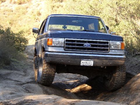 1989 Ford Bronco - This 1989 Ford Bronco navigates a challenging off-road path.