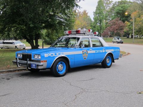 2001 Ford Crown Victoria - Photograph of an NYPD Highway Patrol Dodge police car, not a technical document.