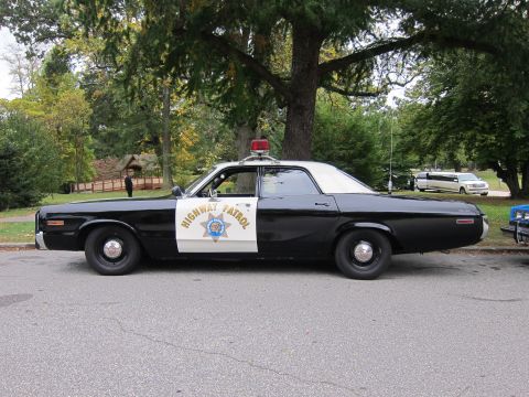 2001 Ford Crown Victoria - Photograph of a CHP Dodge Highway Patrol cruiser, not a technical document.