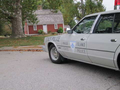 2001 Ford Crown Victoria - Photograph of a Rhode Island State Police sedan, not a technical document.