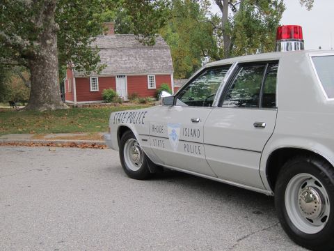 2001 Ford Crown Victoria - Photograph of a Rhode Island State Police sedan, not a technical document.