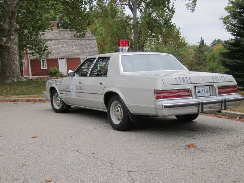 2001 Ford Crown Victoria - Photograph of a Rhode Island State Police sedan, not a technical document.