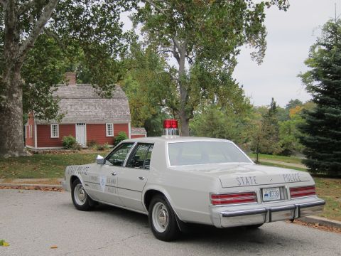 2001 Ford Crown Victoria - Photograph of a Rhode Island State Police sedan, not a technical document.