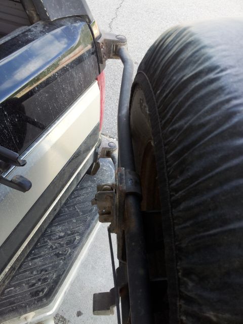 1995 Ford Bronco - Bent the hell outta the tire carrier.