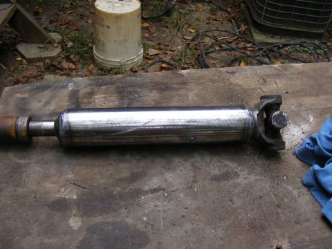Driveshaft with U-joint on a wooden surface