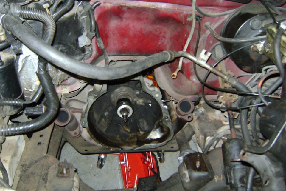 engine bay with transmission removed, showing clutch assembly and flywheel housing