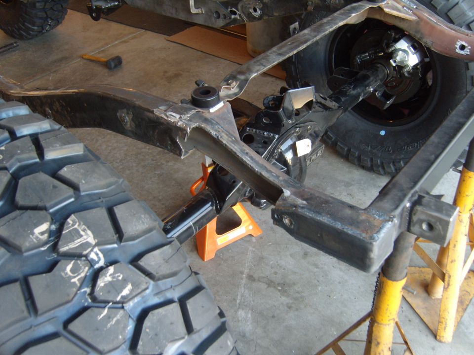 Jeep CJ7 frame and suspension with large off-road tire