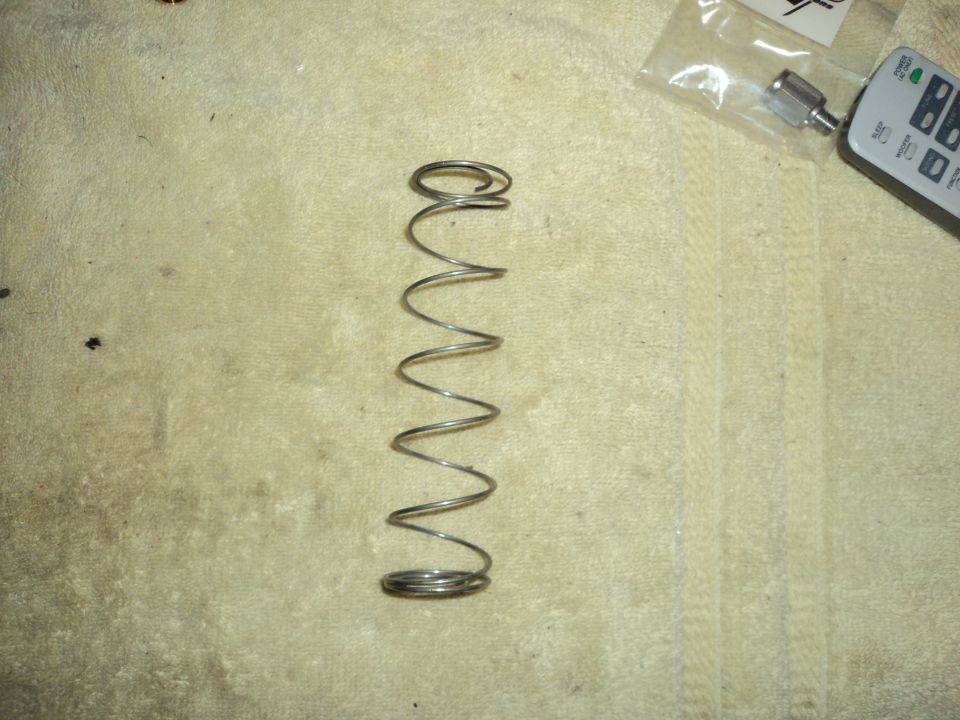 Metal spring on textured surface with remote control and fitting
