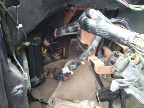 1994 Ford Bronco - This image shows the complex wiring harness and components located behind the dashboard of a vehicle.