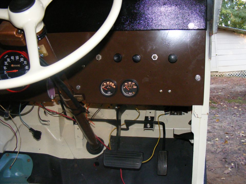 1978 Ford Bronco interior showing dashboard, steering wheel, pedals, and gauges