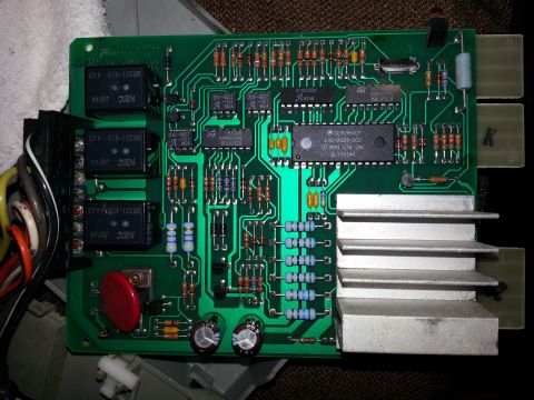 1994 Ford Bronco - This electronic control module features multiple relays and a central processing chip with a 1990 date.