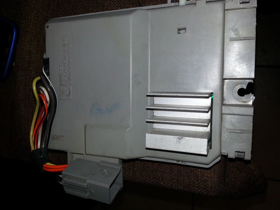 Gray automotive electronic control module with wiring harness and gray connector