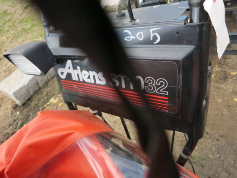 1991 Ford LTD Crown Victoria - Close-up of the Ariens ST32 snowblower's control panel and light.