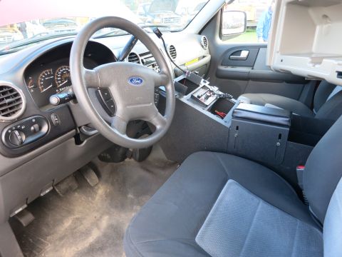 1991 Ford LTD Crown Victoria - Interior view of a Ford Expedition, likely from the early 2000s, equipped with police radio equipment.