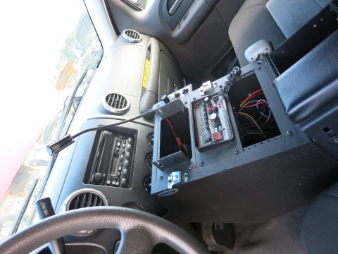 1991 Ford LTD Crown Victoria - The interior of a truck is visible, a radio, steering wheel, and a custom control panel with wiring.