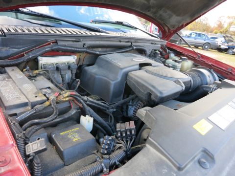 1991 Ford LTD Crown Victoria - Close-up view of a vehicle's engine bay, showing various components and wiring.