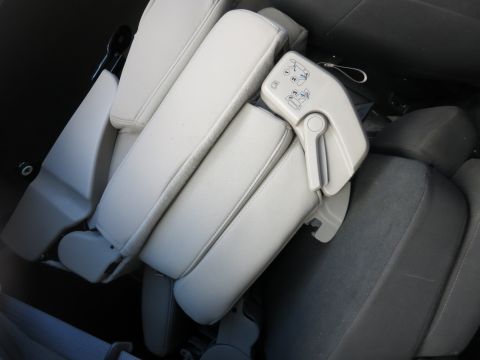 1991 Ford LTD Crown Victoria - Interior view of folded car seats, showing a mechanism with instructions.