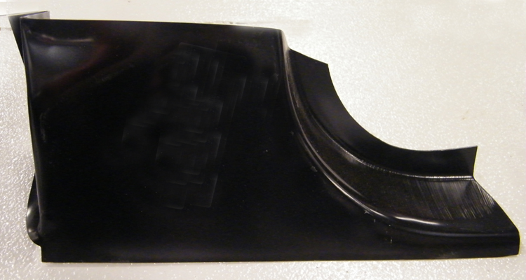 black metal car part with curved edges
