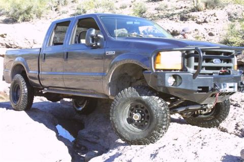 1994 Ford Bronco - This Ford F-250 pickup truck is equipped for off-road adventures, with a heavy-duty bumper and large tires.