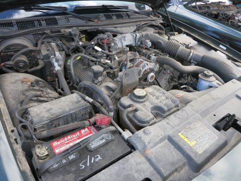 1991 Ford LTD Crown Victoria - Engine bay of a 1991 Ford Crown Victoria LTD, showing the V8 engine and associated components.