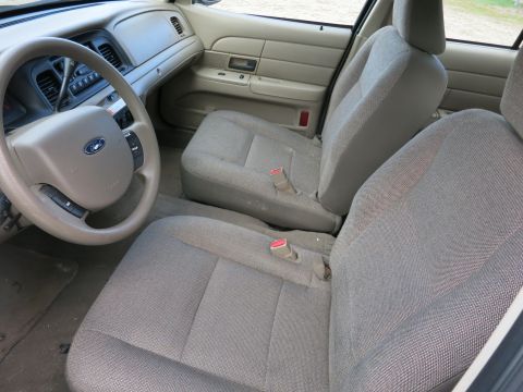 1991 Ford LTD Crown Victoria - Front interior view of a 2003 Ford Crown Victoria, showing seats, steering wheel, and dashboard.