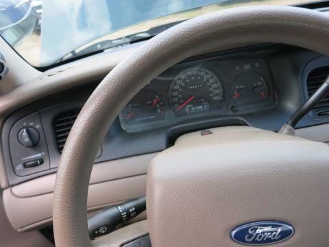 1991 Ford LTD Crown Victoria - Interior view of a car's dashboard, showing the steering wheel, instrument cluster, and Ford logo.