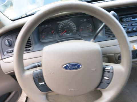 1991 Ford LTD Crown Victoria - The interior of a Ford vehicle, the steering wheel, dashboard, and gauges.