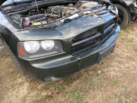 1991 Ford LTD Crown Victoria - Photograph of a sedan front end with damage, not a technical document.