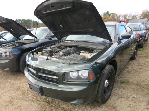 1991 Ford LTD Crown Victoria - Photograph of a sedan with open hood at a vehicle lot, not a technical document.