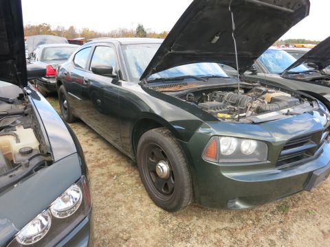 1991 Ford LTD Crown Victoria - Photograph of a sedan at a surplus auction lot, not a technical document.