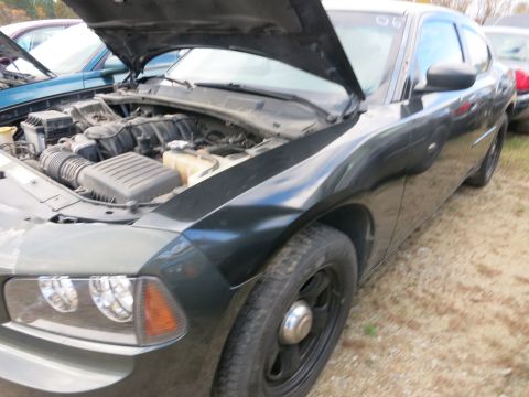 1991 Ford LTD Crown Victoria - Photograph of a sedan with open hood, not a technical document.