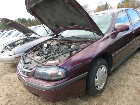 1991 Ford LTD Crown Victoria - Photograph of a sedan with open hood, not a technical document.