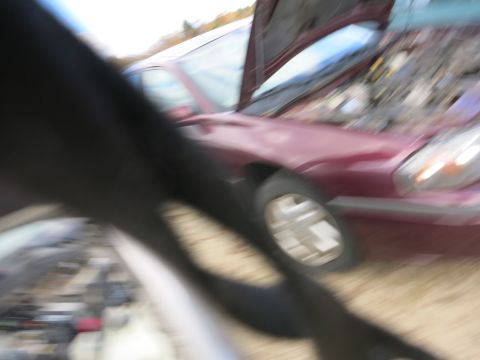 1991 Ford LTD Crown Victoria - Out-of-focus photograph of a sedan, not a technical document.