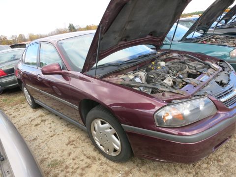 1991 Ford LTD Crown Victoria - Photograph of a sedan with open hood, not a technical document.