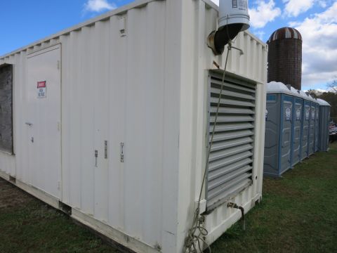 1991 Ford LTD Crown Victoria - Photograph of a container generator enclosure, not a technical document.